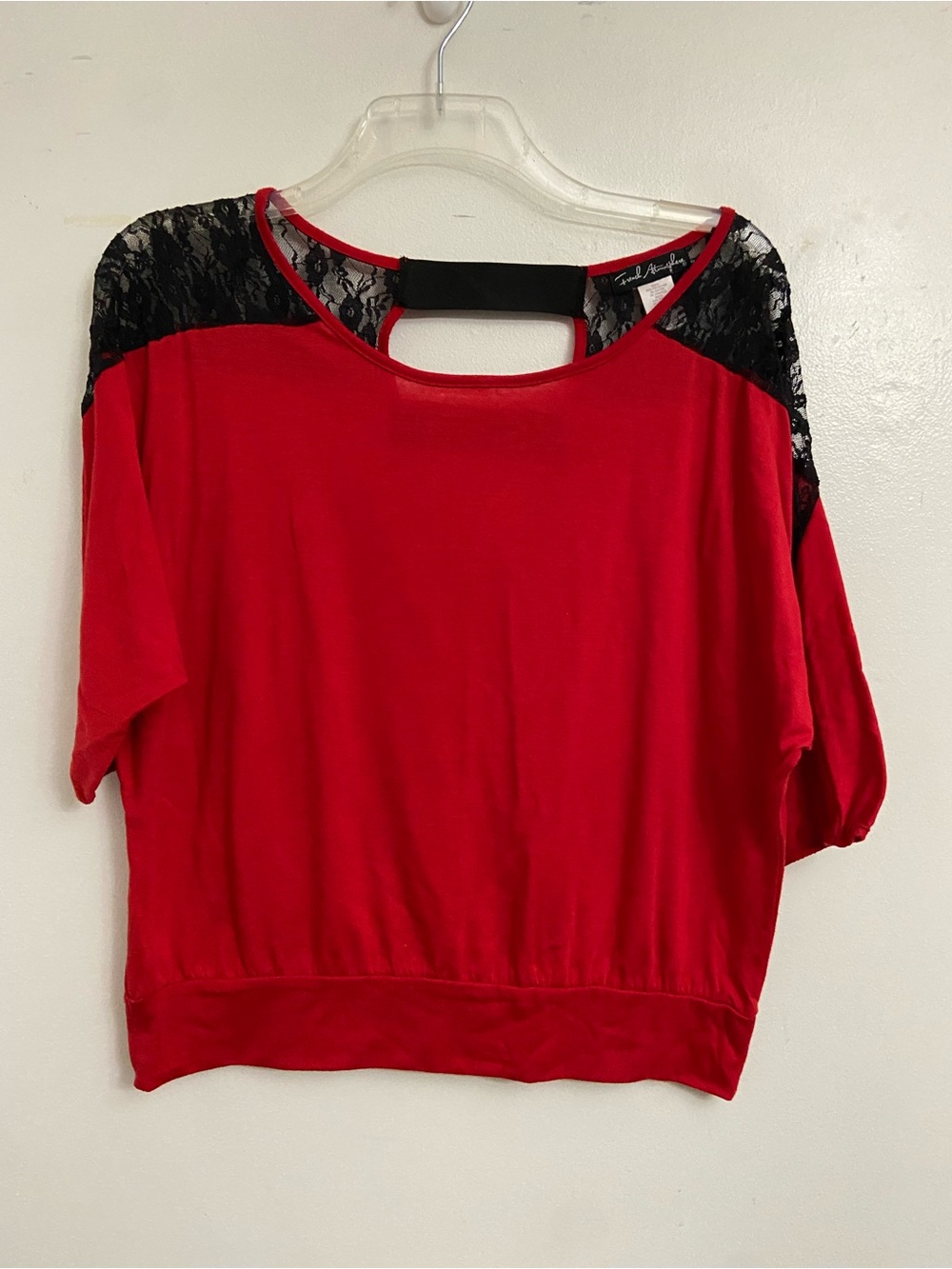 Striking red blouse with beautiful black lace shoulder detail and cut-out back